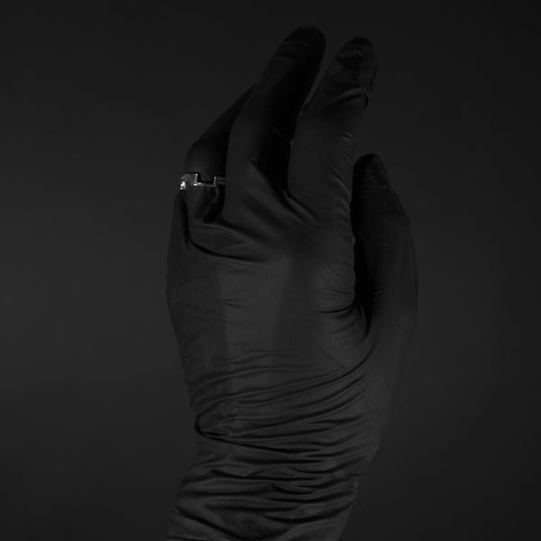 Silver Ring on Finger with Black Gloves